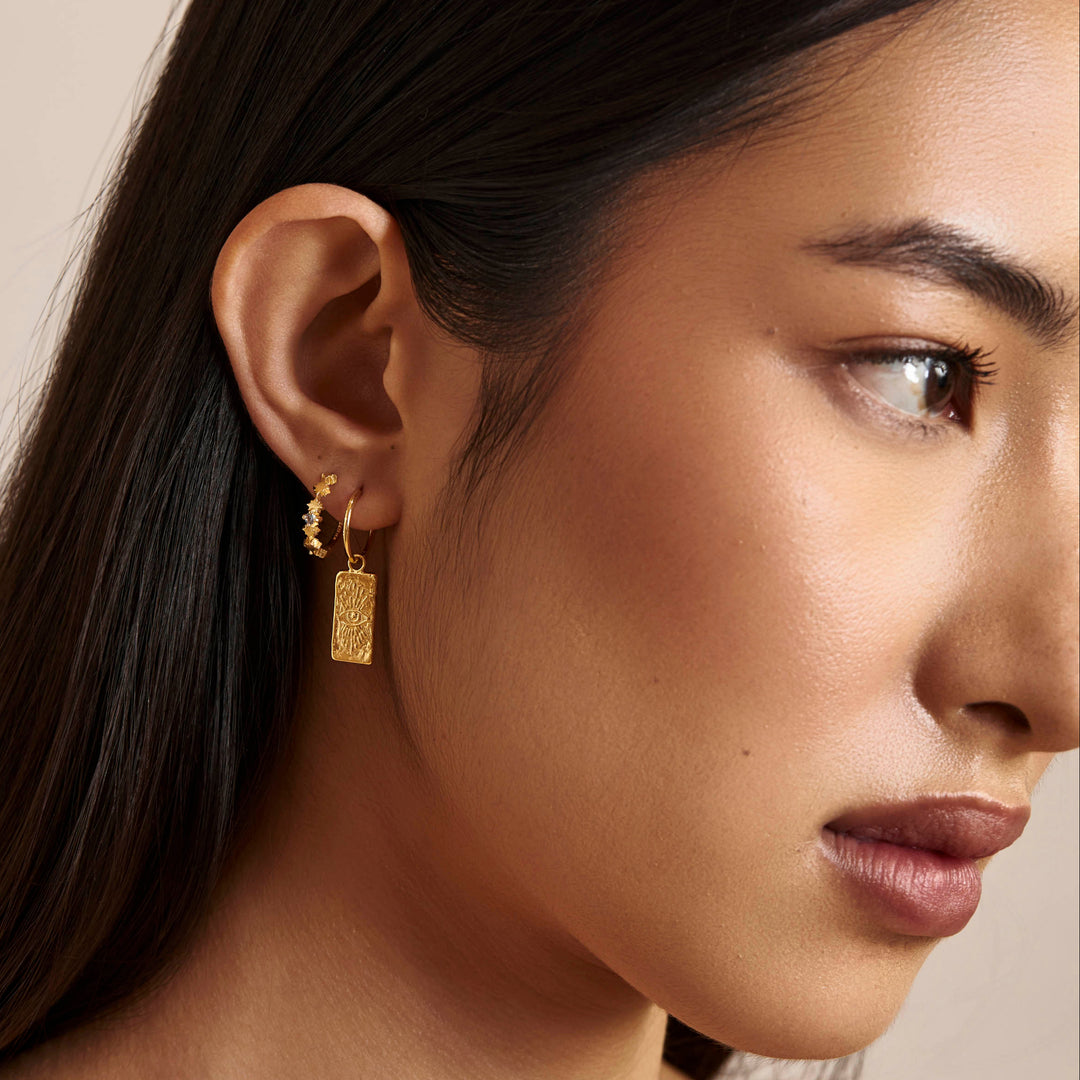 Night Glow Blue Topaz Huggies Gold