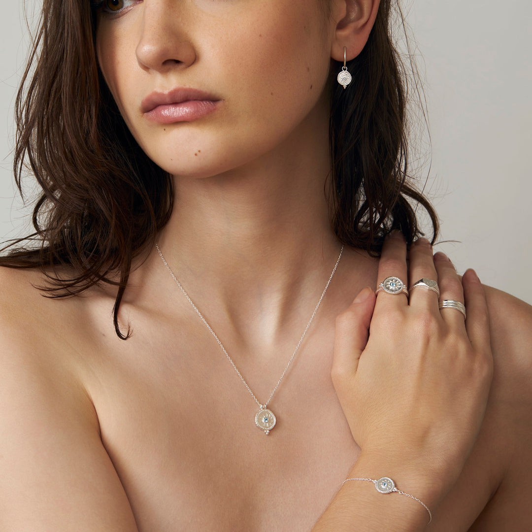 Helios Blue Topaz Huggies